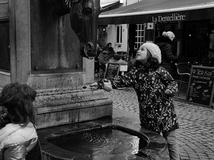 Bruges Belgium girl at fountain