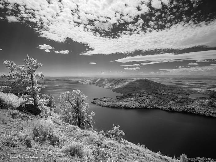 An infrared photograph of Fremon Lake shot from an overlook above the lake.