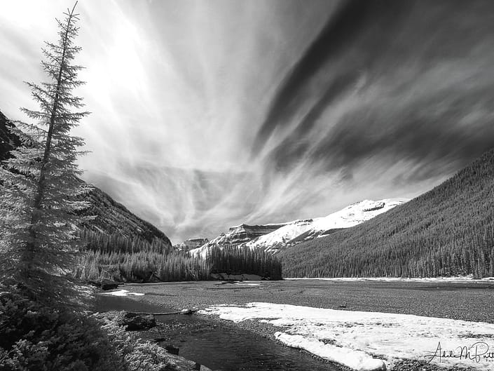 Spectacular clouds above the Athabasca River, Canadian Rockies. Shot in infrared and converted to black and white.